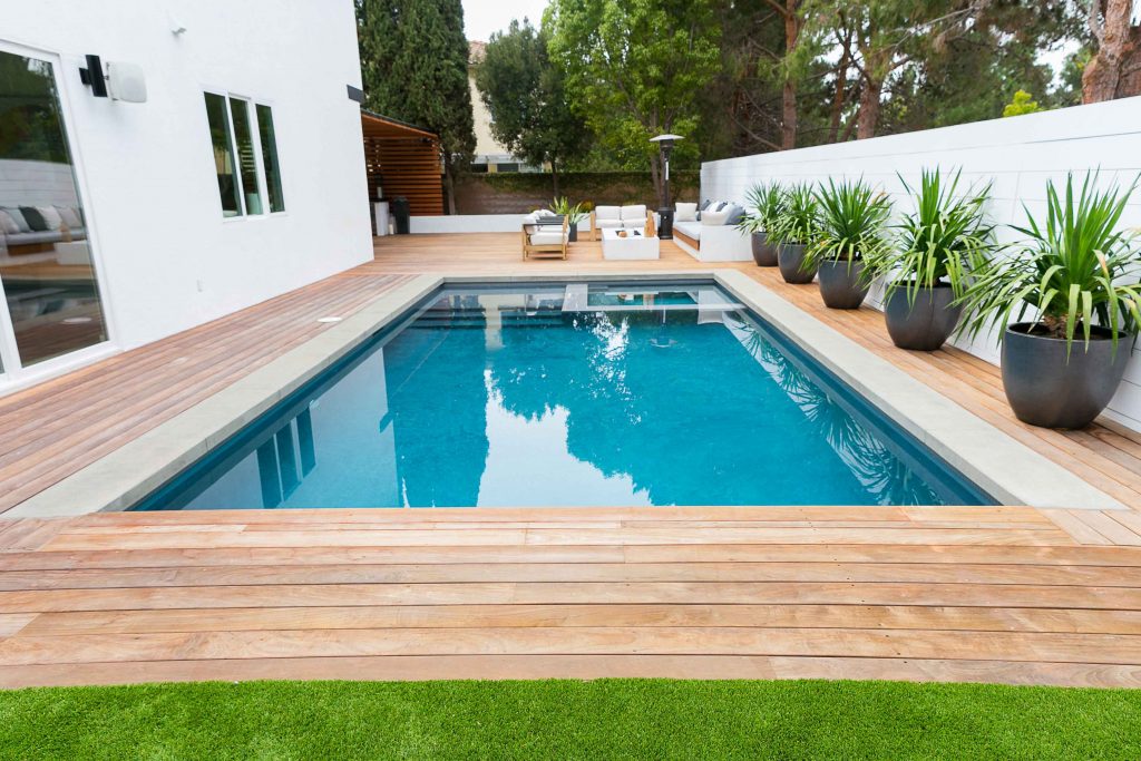 Remodeled Pool Surrounded by Wooden Deck --
