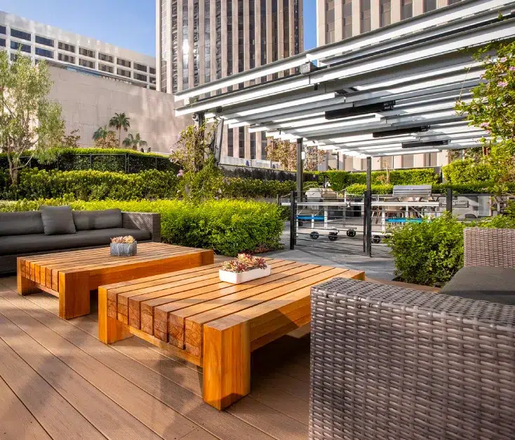 Outdoor terrace with couches and coffee tables on hardwood decking for hotels and restaurants