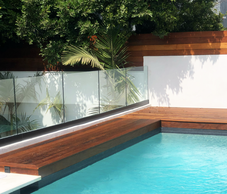deck railings next to a pool