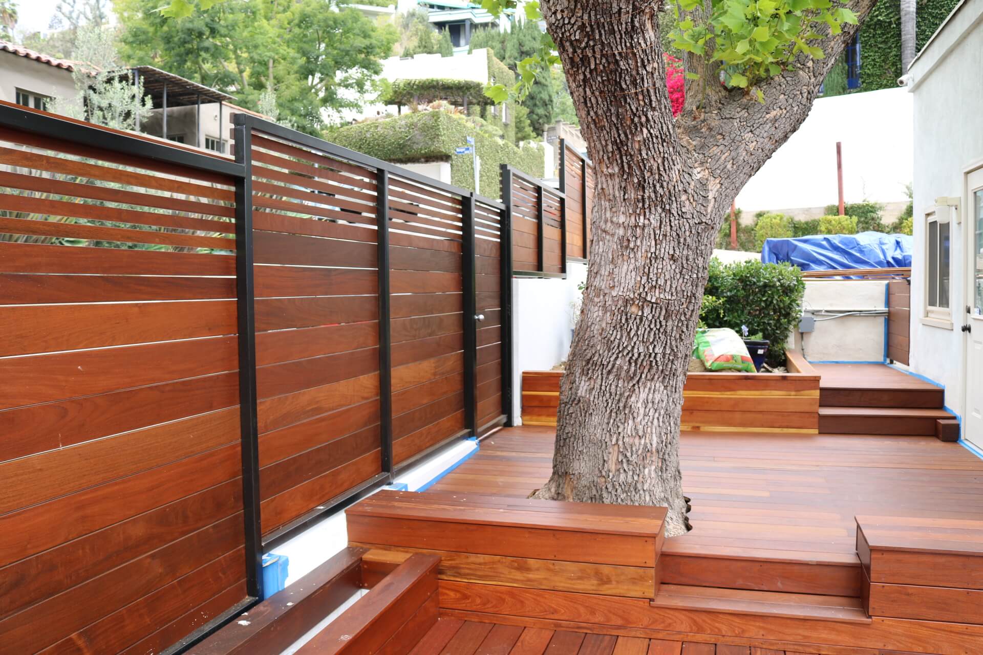 Shiny Lumber Deck Surrounded by Wooden Fence