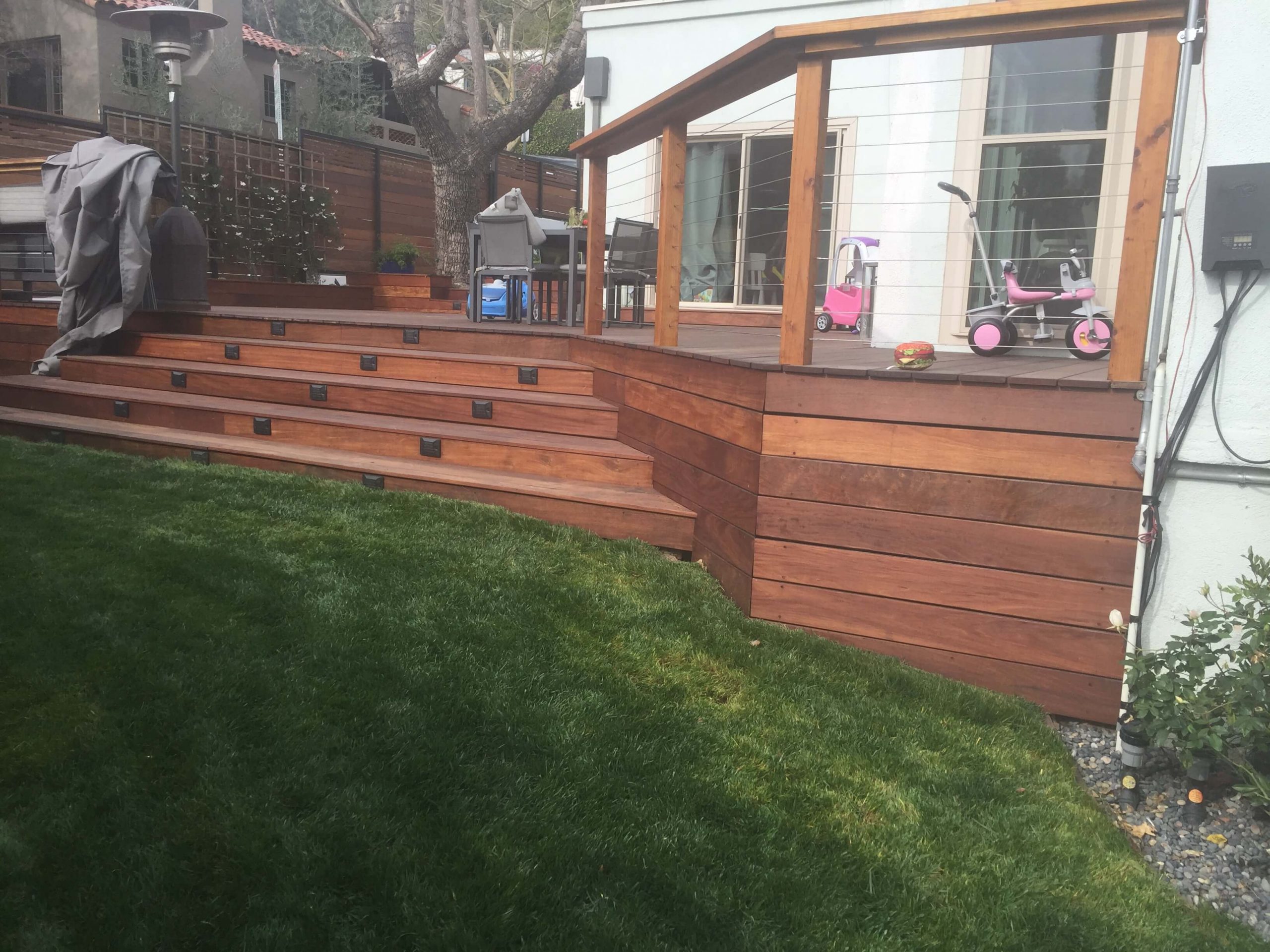 Wooden Deck Outlined by Steel Cable Railing