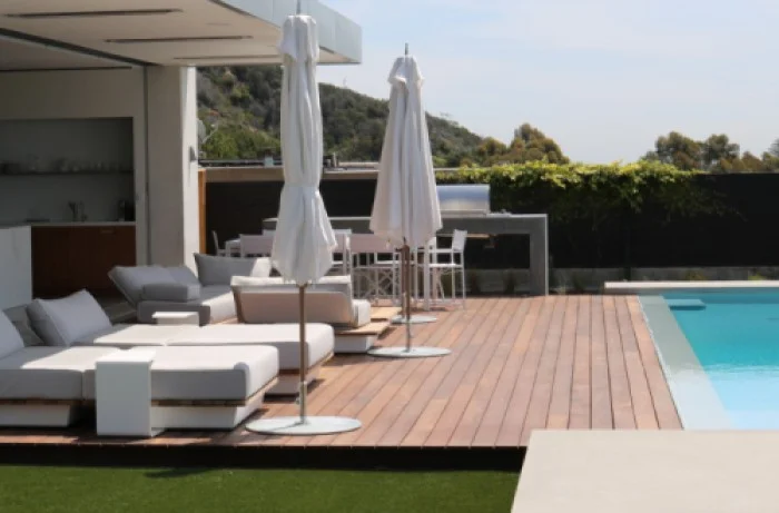 Luxury poolside composite deck installation with lounge seating in Pacific Palisades, built by LA Decks.