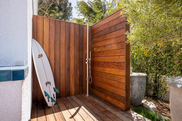 A custom hardwood outdoor shower and deck structure in Brentwood by LA Decks.